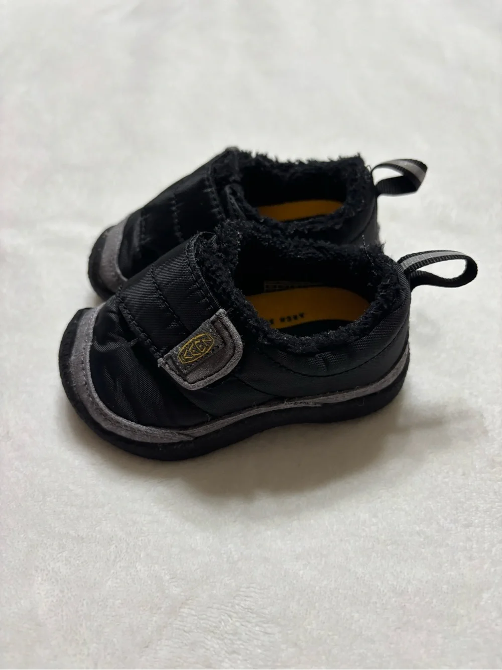 Keen Black and Gray Kids Slip-On Shoes with Yellow Logo